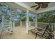 Relax on this outdoor deck, complete with lounge chairs and a spiral staircase at 944 Hammocks Way, Edisto Island, SC 29438