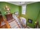 Inviting staircase with a window and green walls welcomes you into this lovely home at 944 Hammocks Way, Edisto Island, SC 29438