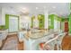 Spacious kitchen with granite countertops, white cabinets, and a large island with seating, perfect for entertaining at 944 Hammocks Way, Edisto Island, SC 29438