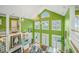 Bright living room featuring high ceilings, a chandelier, and an open floor plan leading to the dining area and natural light at 944 Hammocks Way, Edisto Island, SC 29438