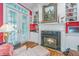 Cozy living room featuring a fireplace, built-in shelves, and French doors at 944 Hammocks Way, Edisto Island, SC 29438