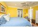 Well-lit main bedroom with french doors, ceiling fan, and stylish decor at 944 Hammocks Way, Edisto Island, SC 29438