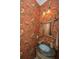 Unique powder room featuring heron wallpaper, accent lighting, and marble sink at 944 Hammocks Way, Edisto Island, SC 29438