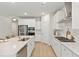 Elegant kitchen with white cabinets, quartz countertops, and stainless steel appliances at 1006 Tulip Shell St, Summerville, SC 29485