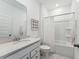Clean bathroom with white vanity, white tile, and a shower-tub combination at 1008 Tulip Shell St, Summerville, SC 29485