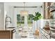Sun-drenched dining area with adjacent gourmet kitchen, light-filled and perfect for entertaining at 1008 Tulip Shell St, Summerville, SC 29485