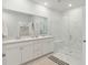 Bright bathroom featuring double sinks, a walk-in shower, and ample cabinet space at 1014 Tulip Shell St, Summerville, SC 29485