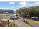 Inviting community entrance with signage, landscaped median, a covered area, and a glimpse of the pond at 1014 Tulip Shell St, Summerville, SC 29485