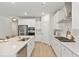 Open kitchen with stainless steel appliances, bright white cabinets, and a view to the dining area at 1014 Tulip Shell St, Summerville, SC 29485