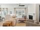Inviting living room features a comfortable couch, fireplace, and a ceiling fan for added comfort at 1014 Tulip Shell St, Summerville, SC 29485