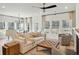 Inviting living room features a comfortable couch, natural lighting, and a ceiling fan for added comfort at 1014 Tulip Shell St, Summerville, SC 29485