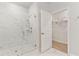 Modern bathroom shower features elegant marble tiling, rainfall shower head, and glass door at 1014 Tulip Shell St, Summerville, SC 29485