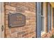Close up showing the property address on a decorative plaque at 103 Laurens Ct, Summerville, SC 29485