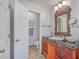 Charming bathroom with a unique vanity, decorative mirror, and tiled floor at 103 Laurens Ct, Summerville, SC 29485
