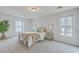 Light-filled bedroom featuring a bed with windows, neutral walls, and carpet flooring at 103 Laurens Ct, Summerville, SC 29485