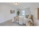 Bright bedroom with natural light, showcasing bed and neutral decor at 103 Laurens Ct, Summerville, SC 29485