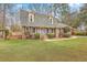 Charming two-story brick home with a well-manicured lawn and a welcoming blue front door at 103 Laurens Ct, Summerville, SC 29485