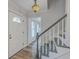 Bright foyer with staircase and view into adjacent rooms at 103 Laurens Ct, Summerville, SC 29485