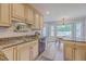 Updated kitchen featuring granite counters, stainless appliances, wood cabinets, and eat-in dining area at 103 Laurens Ct, Summerville, SC 29485