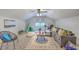 Bright living room features large gray couch, modern rug, teepee, and lots of natural light at 103 Laurens Ct, Summerville, SC 29485