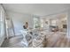 Open concept living room with exposed fireplace and natural light from multiple windows at 103 Laurens Ct, Summerville, SC 29485