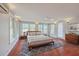 Bright main bedroom suite featuring hardwood floors, lots of windows, and neutral decor at 103 Laurens Ct, Summerville, SC 29485