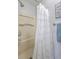 Clean shower featuring white tiled walls and white shower curtain at 103 Laurens Ct, Summerville, SC 29485