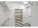 Organized walk-in closet with built-in shelving and hanging rods, providing ample storage at 103 Laurens Ct, Summerville, SC 29485