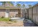 Backyard with brick house, shed, gate, and galvanized stock tank at 103 Sprucewood Dr, Summerville, SC 29485