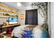 This is a cozy bedroom featuring decorative shelves and natural lighting from the window at 103 Sprucewood Dr, Summerville, SC 29485