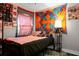 Comfortable bedroom with vibrant tapestries and contemporary furnishings at 103 Sprucewood Dr, Summerville, SC 29485