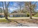 Charming single story house with a well-manicured lawn and blue door at 103 Sprucewood Dr, Summerville, SC 29485