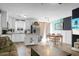 Modern kitchen with white cabinets, stainless steel appliances, and a cozy dining area at 103 Sprucewood Dr, Summerville, SC 29485