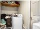 Laundry room featuring modern white appliances and overhead storage at 103 Sprucewood Dr, Summerville, SC 29485