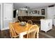 This is a living room with wood dining table and chairs with a brown corduroy sofa at 103 Sprucewood Dr, Summerville, SC 29485