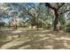 Large backyard with mature trees and open space for recreation at 104 Gervais St, Walterboro, SC 29488