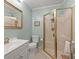 Cozy bathroom with tiled shower, white toilet, and traditional vanity at 104 Gervais St, Walterboro, SC 29488
