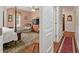 Spacious bedroom features a four-poster bed, ceiling fan, and comfortable sitting area at 104 Gervais St, Walterboro, SC 29488
