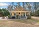 Charming home with a front porch, well-manicured lawn, and inviting curb appeal at 104 Gervais St, Walterboro, SC 29488
