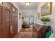 Welcoming foyer showcasing hardwood floors, decorative accents, and a glimpse into the inviting living spaces at 104 Gervais St, Walterboro, SC 29488