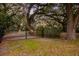 Gated entrance framed by mature trees, enhancing privacy and adding natural beauty to the property at 104 Gervais St, Walterboro, SC 29488