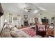 Bright living room with fireplace, high ceilings, ceiling fan and ample seating at 104 Gervais St, Walterboro, SC 29488