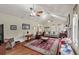 Bright living room features vaulted ceiling, hardwood floors, and a cozy seating area at 104 Gervais St, Walterboro, SC 29488