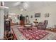 Spacious living room with vaulted ceiling, area rug, and a ceiling fan at 104 Gervais St, Walterboro, SC 29488
