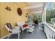 Inviting porch with comfortable wicker furniture and neutral decor at 104 Gervais St, Walterboro, SC 29488
