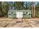 A shed with double doors and a ramp for easy access at 104 Gervais St, Walterboro, SC 29488