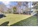 The backyard features a lush green lawn and air conditioning unit at 107 Four Iron Dr, Summerville, SC 29483
