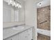 Bathroom featuring a white vanity with marble countertop and an open shower with a glass door at 107 Four Iron Dr, Summerville, SC 29483