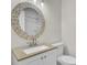 Traditional bathroom with decorative mirror, granite counters, and white cabinets at 107 Four Iron Dr, Summerville, SC 29483