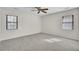 Bedroom with neutral carpet, ceiling fan, and two windows at 107 Four Iron Dr, Summerville, SC 29483